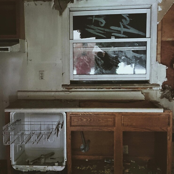 abandoned-kitchen-with-broken-window-glass_1048944-7957092